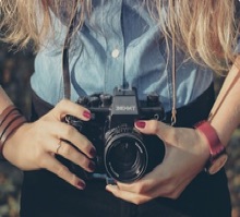 girl holding a camera - Private Lessons witht he School of Photography